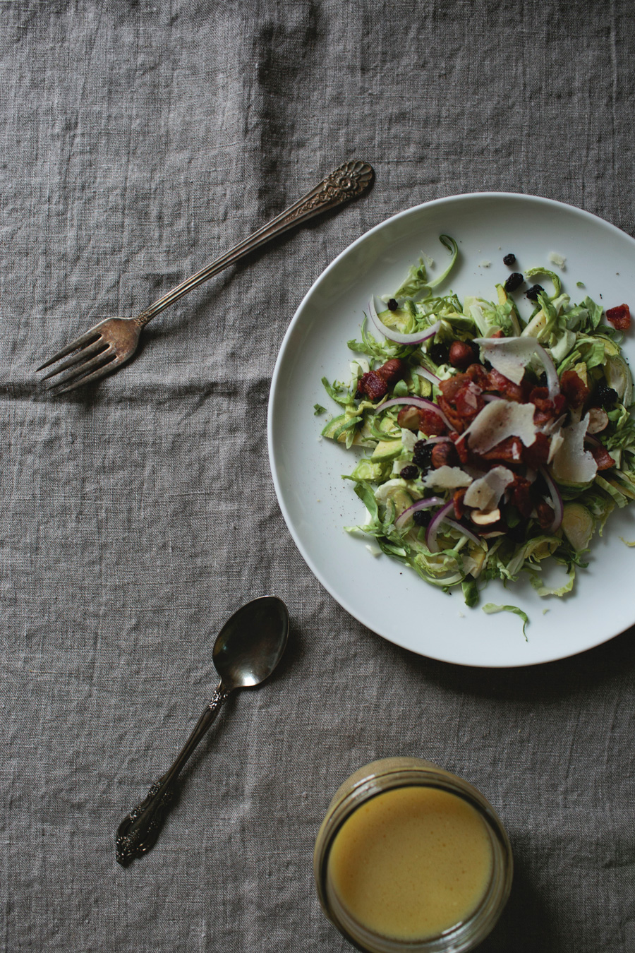 shaved brussels sprout salad with currants and bacon vinaigrette // a thousand threads